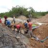 Galamsey operation in Ghana (where else?)
Galamsey is the term used in Ghana to denote illegal miners. It doesn't mean they are claim jumpers, just that they don't get the proper permits from the government... but you can bet they did get the permission of the local chief.