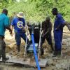 Joe shows the galamsey boys how the CC690 operates.