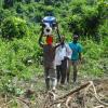 Everything in Ghana is transported on top of the head. Even 70 pounds of pump and hose.