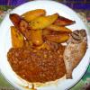 Typical dinner - A small piece of meat (fish in this case), beans and fried plantains.